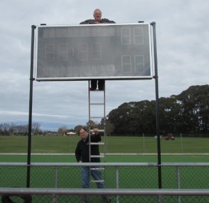 Bruce Becker and work colleague installing the score boards at GHC.